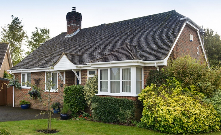 White uPVC roofing fascias, soffits, and guttering installed by Surrey Roofers, offering durable and low-maintenance roofline solutions.